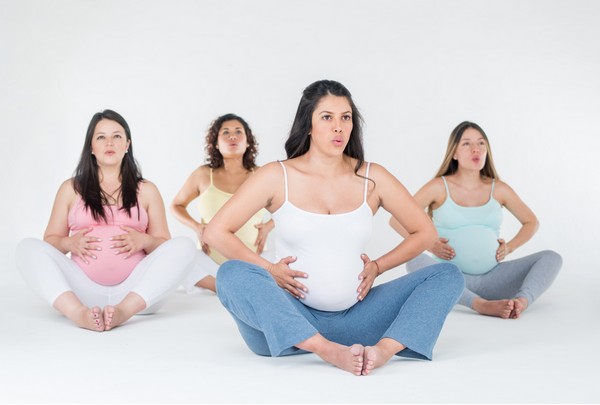 pregnant women practicing breathing