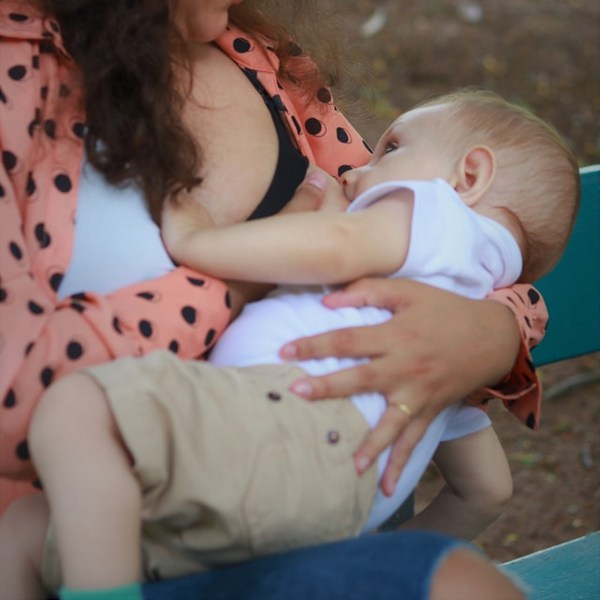 a woman breastfeeding a baby