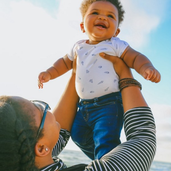 a woman holding a baby