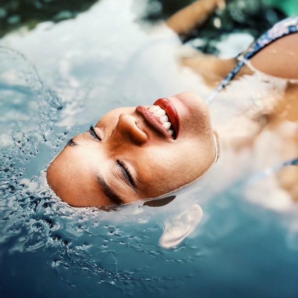 woman floating  in water