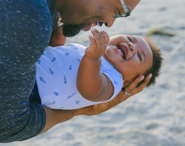 a man holding a baby