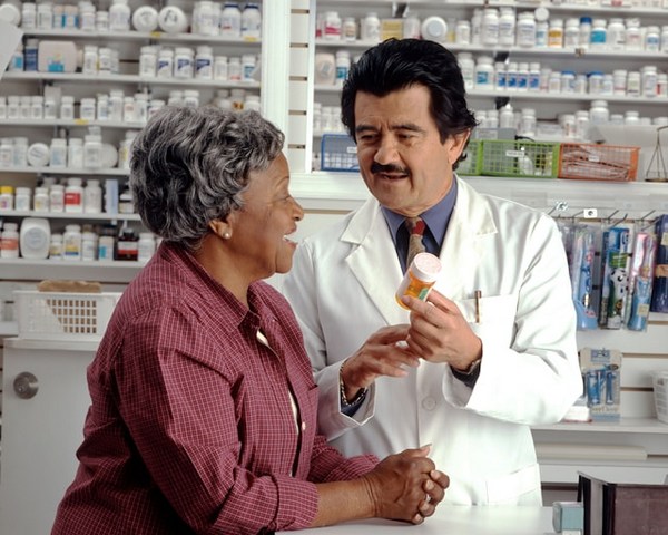 a man and woman in a pharmacy