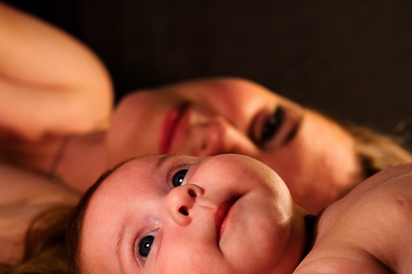 a woman holding a baby