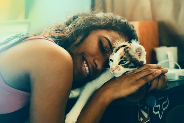 a woman holding a cat