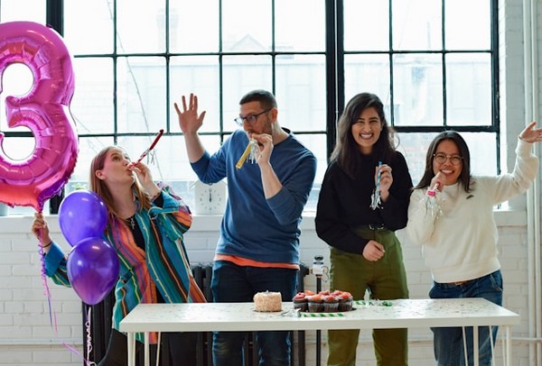 people celebrating with cake