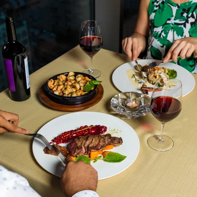 a group of people eating at a table