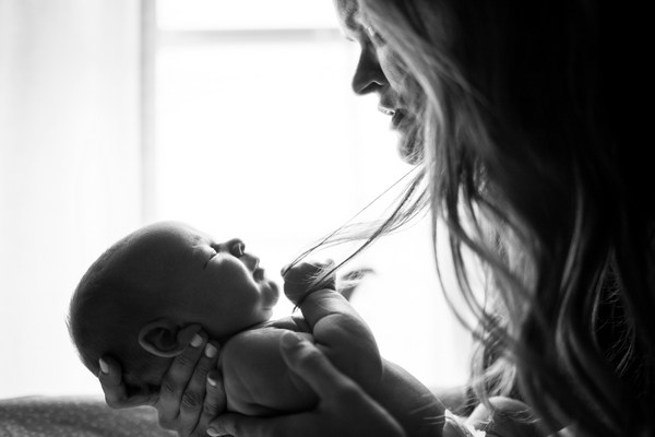 a woman holding a baby